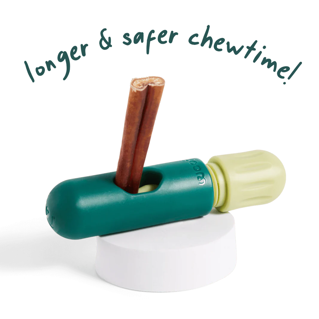 Close-up of The BullySafe securely holding a bully stick, preventing choking and extending chew time.