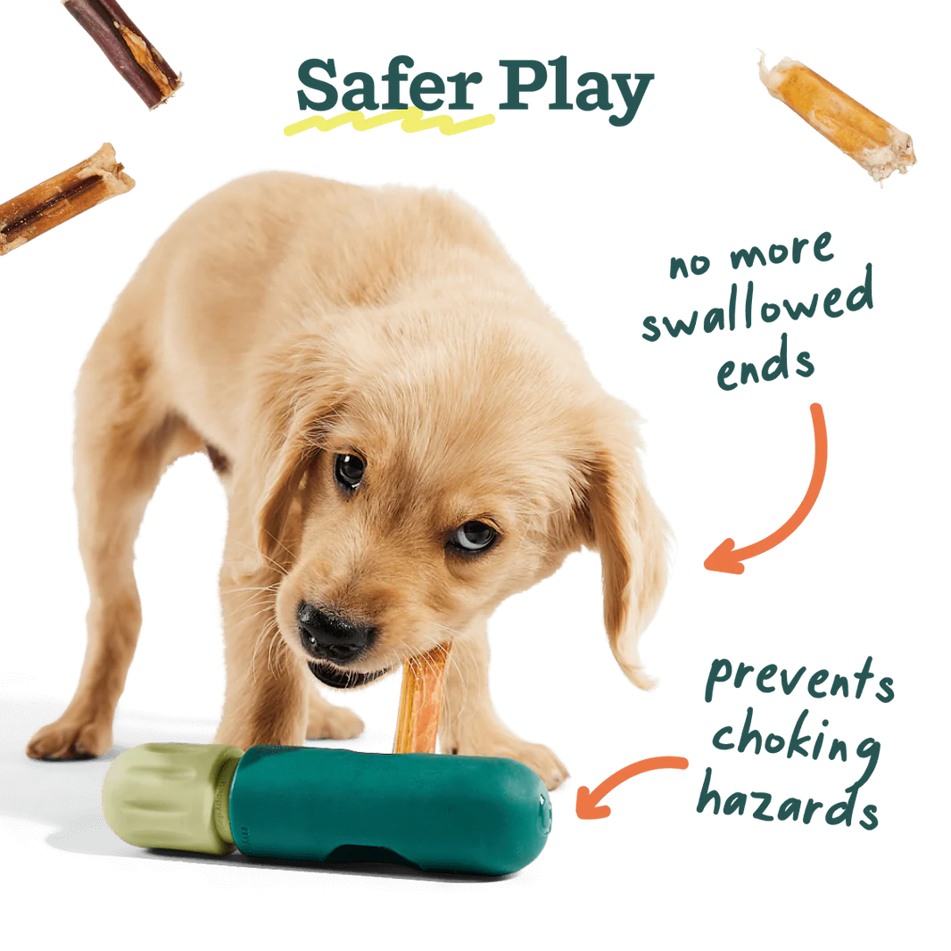 A happy puppy enjoying a bully stick safely held in The BullySafe, reducing choking risks on small ends.