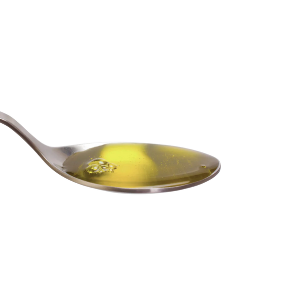 A spoonful of Ahiflower Oil, showcasing its smooth consistency, easy absorption, and powerful omega-3 benefits for pets.