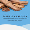 A detailed close-up of Crumps' Naturals Beef Lung Tendersticks, showing their tender, easy-to-break texture, slow-baked process, and natural beef goodness.