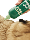 An image showing Earth Rated Short Coat 3-in-1 Dog Shampoo being applied to a short-coated dog, highlighting the deep clean nozzle for even application.