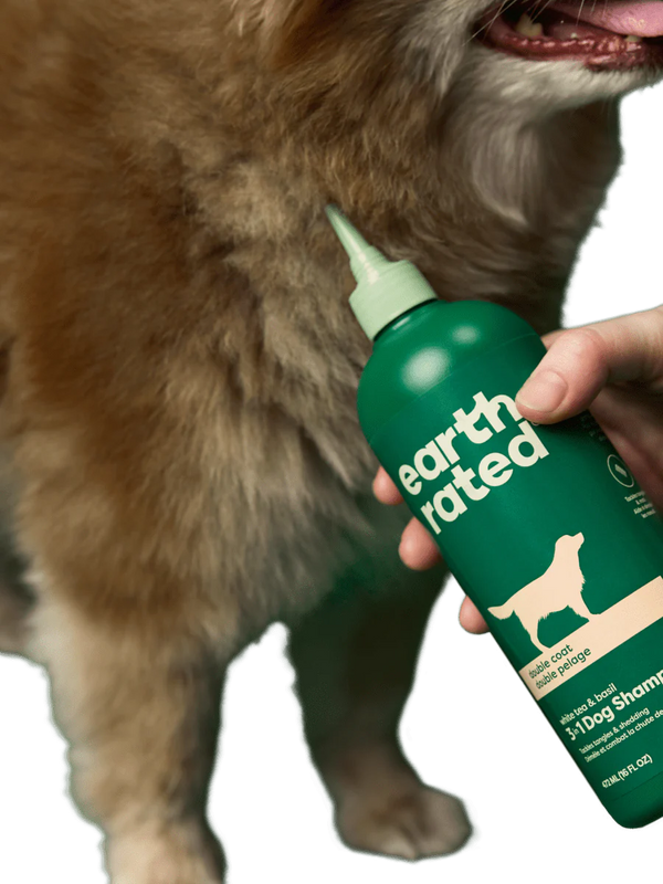 Earth Rated 3-in-1 Shampoo for Double Coated Dogs showing how the nozzle penetrates through thick double coated dogs