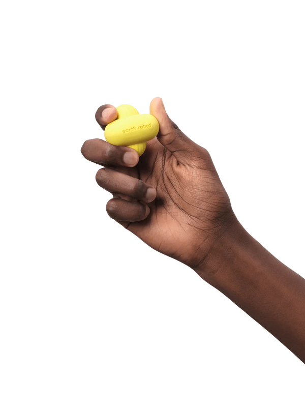 Person holding the small-sized Earth Rated Fetch Toy, demonstrating its lightweight and easy-to-hold design for both dogs and owners.
