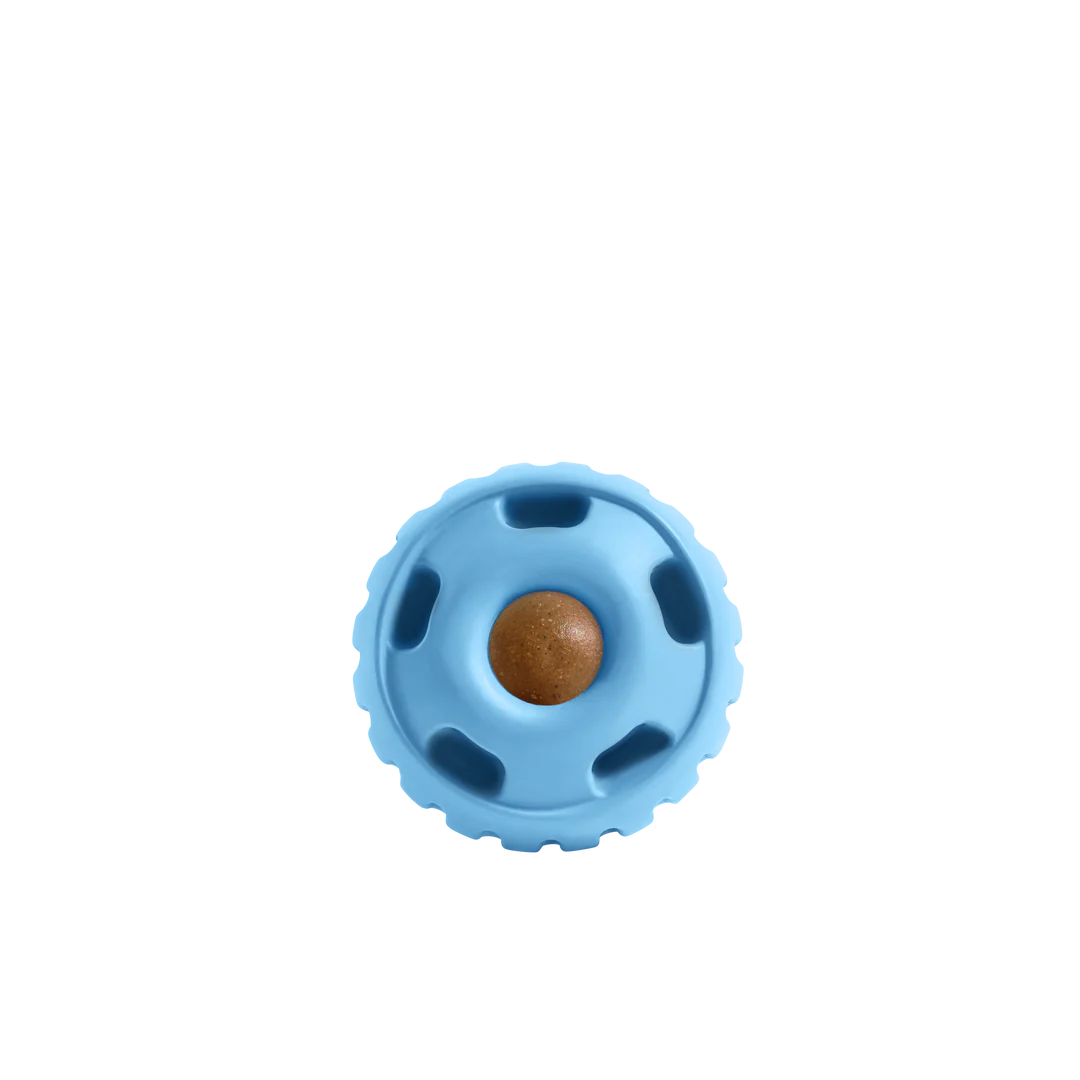 Front view of the Woof Pupsicle in Blue, showcasing its sleek design, twist-open feature, and treat compatibility for interactive play.