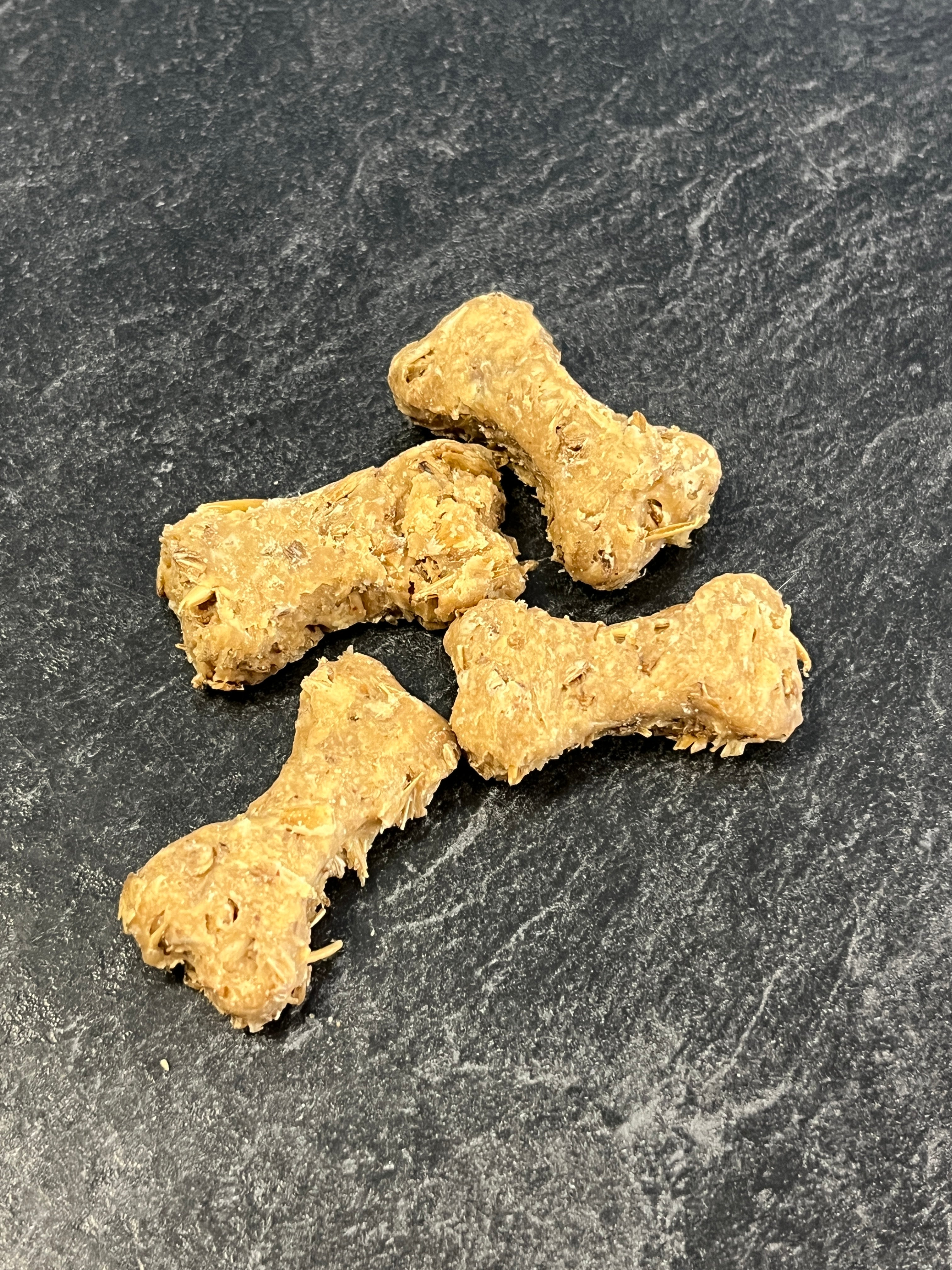 Close-up image of Boozehound Spent Grain Dog Biscuits, showing crunchy texture and natural ingredients made from upcycled brewery grain for gut health, protein, and sustainability.