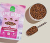 Image displaying the kibble and air-dried morsels in a dog bowl with a scoop and product bag beside, highlighting feeding convenience and visibly nutrient-rich formulation.