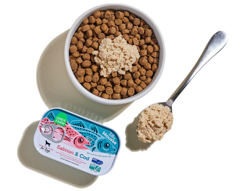 Open Farm Salmon & Cod Topper with kibble, enhancing dog nutrition with delicious, sustainable fish.