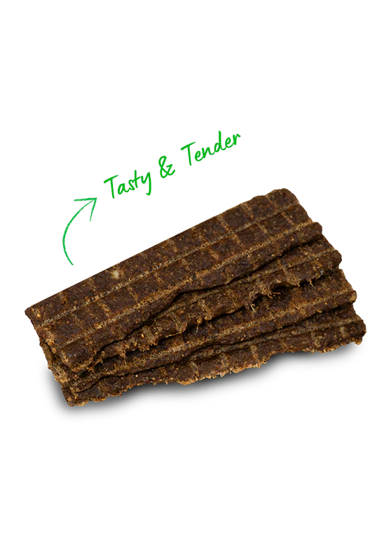 Close-up of Open Farm Grass-Fed Beef Jerky Strips highlighting texture and protein content.