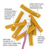 A zoomed-in image of the dental sticks, showcasing their new floral shape and flexible texture, designed for better tooth coverage and safer chewing.