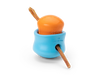 Image of a small West Paw Toppl toy placed inside a large Toppl, with a bully stick inserted through both, demonstrating a creative way to use the toy.