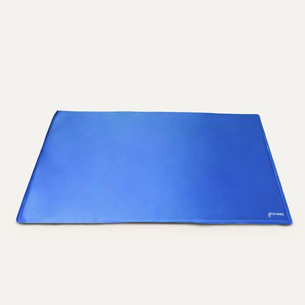 Image displaying the Goo-Eez Cooling Mat fully laid out, showcasing its smooth, durable surface and ample space for dogs to comfortably stretch and cool down.