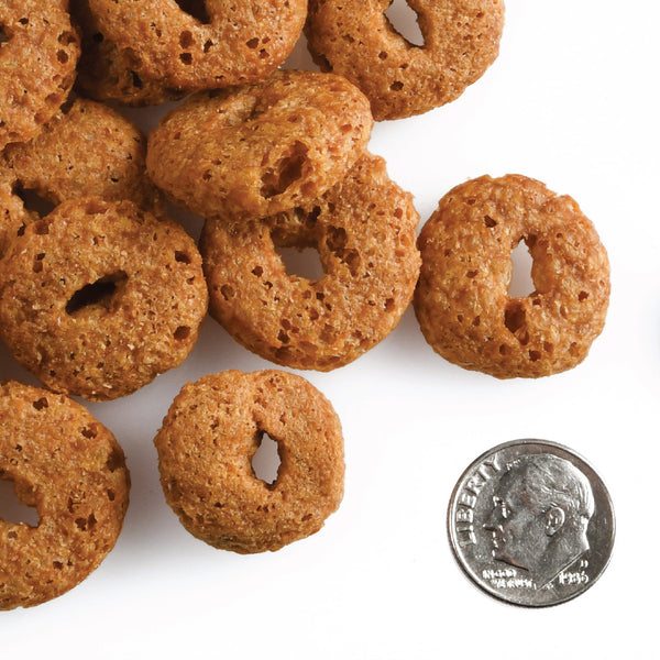 Fromm crunchy o's dog treat smokin' cheeseplosion up close showing the size and texture of these crunchy dog treats