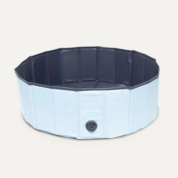 Image showing a front-facing view of the Goo-Eez Foldable Pet Pool, highlighting its durable design, portable structure, and space-saving foldability for dog cooling needs.