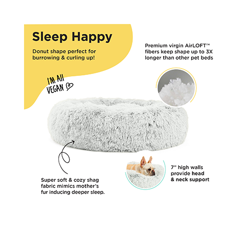 Highlighting the key features of the Best Friends by Sheri Calming Donut Dog Bed, including raised rim support, soft shag fur, and durable materials.