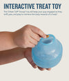 Photo showing how to put treats into the Lil Snoop by Planet dog. This interactive treat toy will keep you pup engaged as they sniff, pay and play to retrieve the tasty rewards.