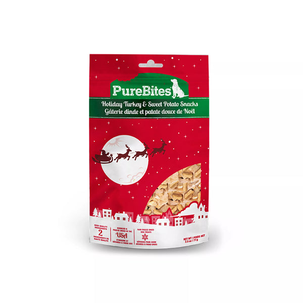 Front view of PureBites Holiday Turkey & Sweet Potato Dog Treats bag featuring festive packaging; highlights that the treats are made with only two simple human-grade ingredients — turkey and sweet potato — freeze-dried RAW for high protein, low calorie nutrition perfect for healthy holiday snacking.