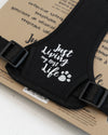 Close-up of the "Living My Best Life" message on the chest of the DexyPaws dog harness highlighting its fun personality while showcasing the comfortable padded front designed for daily wear.