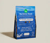Back of Open Farm RawMix Puppy food bag displaying ingredient transparency, feeding guidelines, and nutritional benefits supporting digestion, development, and overall puppy health.