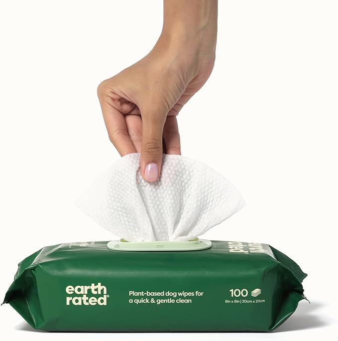 A close-up image of a hand pulling out Earth Rated Unscented Compostable Wipes from the packaging, showcasing ease of use.