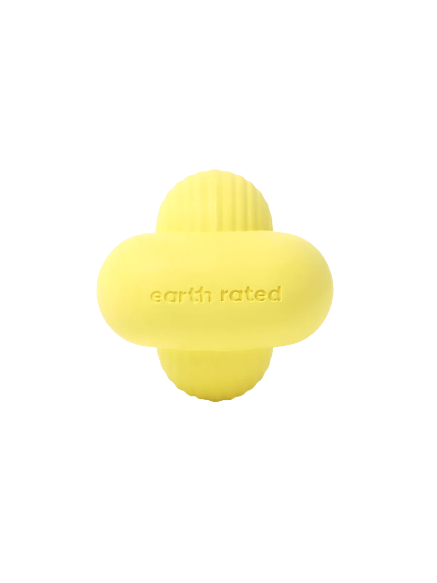 Earth Rated Fetch Toy made from natural yellow rubber with a unique shape designed for easy carrying and unpredictable bouncing.