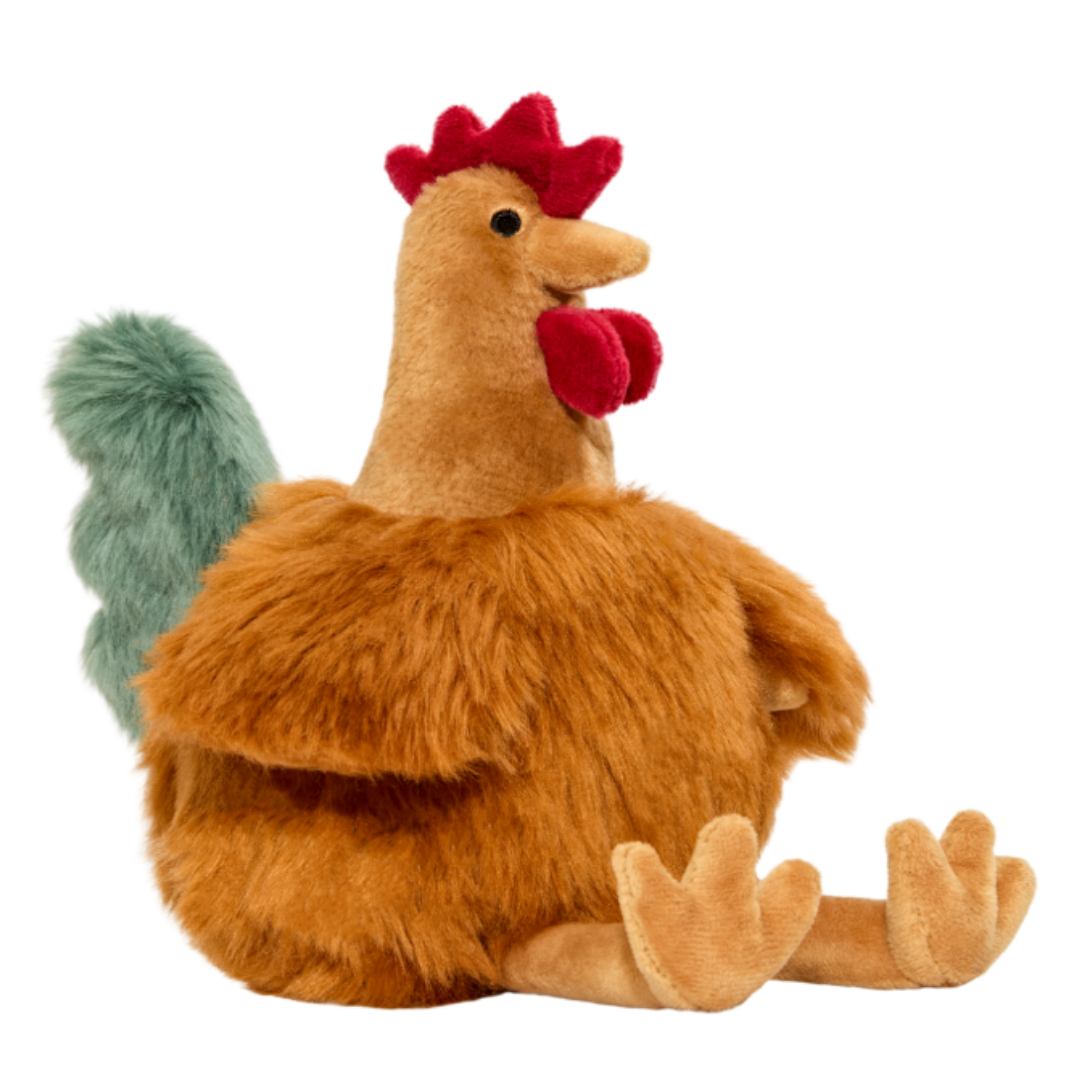 Close-up of Chandler the Chicken plush dog toy sitting upright, showcasing embroidered eyes, premium plush materials, non-toxic filling, and durable craftsmanship that provides comfort during cuddles and confidence during play.