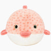 Front-facing close-up of Dottie the Puffer Fish dog toy showcasing embroidered safety details, plush textured exterior, durable double-stitched construction, and an easy-to-grab shape ideal for daily enrichment and play.