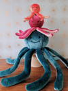 Size comparison of Fluff & Tuff octopus dog toys featuring Olympia the Octopus, Stevie the Octopus, and Squirt the Octopus stacked together, showcasing the differences in size, shape, and play style options available for puppies, small dogs, and larger breeds.
