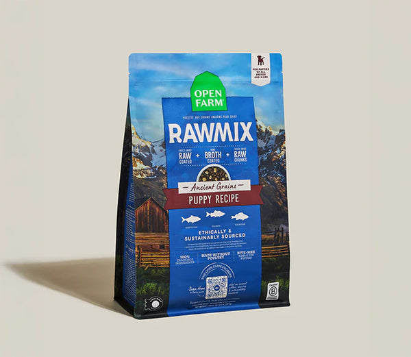 Front of Open Farm RawMix Ancient Grain Puppy dog food bag highlighting wild-caught fish ingredients, DHA for brain development, freeze-dried raw coating, and balanced nutrition for growing puppies.
