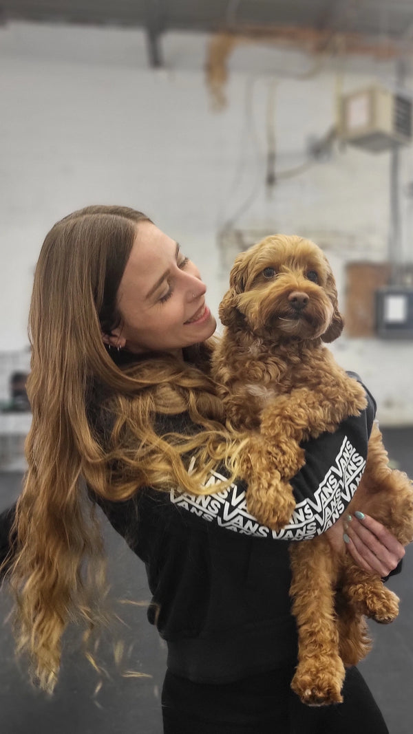 Larissa, our compassionate Dog Daycare Attendant, providing attentive care and supervision to ensure every friend enjoys a safe and playful experience