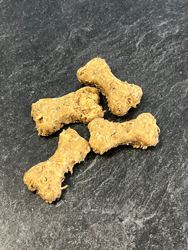 Close-up image of Boozehound Spent Grain Dog Biscuits, showing crunchy texture and natural ingredients made from upcycled brewery grain for gut health, protein, and sustainability.