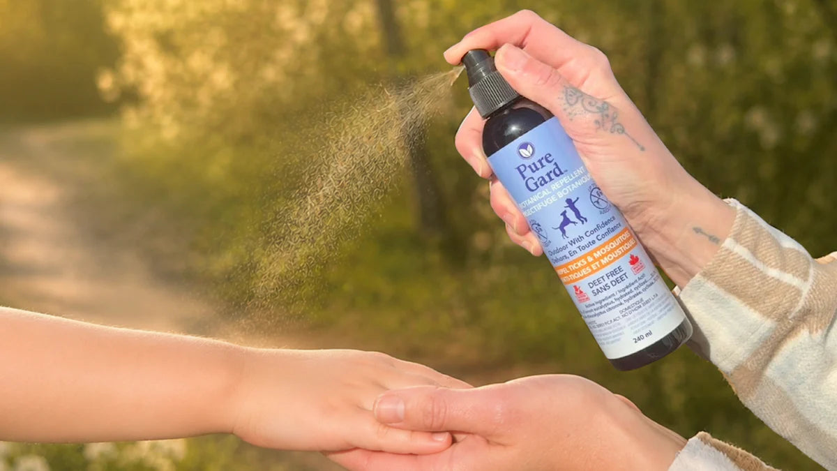 Puregard botanical tick and mosquito repellent showing the spray on a child's are that it's a safe deet alternative for ticks and mosquitoes 