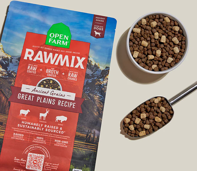 Bag displayed with a full bowl and scoop of protein-rich dog food, highlighting freeze-dried raw chunks, beef bone broth coating, and ancient grains that promote healthy digestion, energy, and lean muscle support