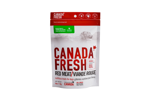 Front view of PetKind Canada Red Meat Treats bag, featuring premium, air-dried dog treats made with natural red meat.