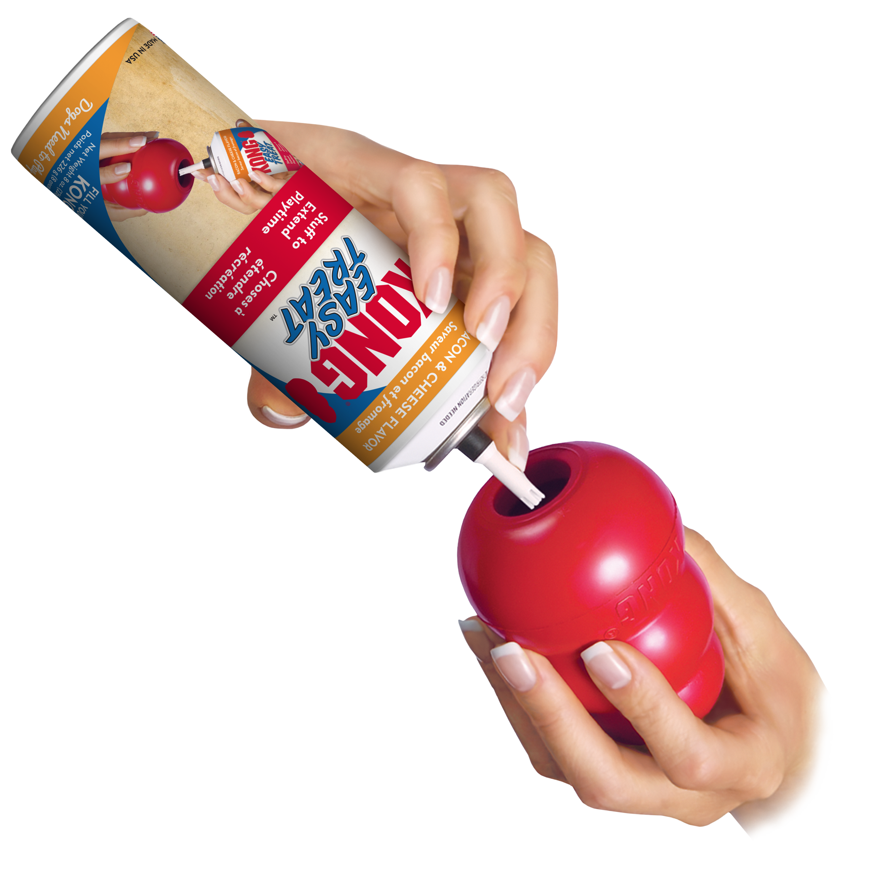 Image showing a hand dispensing KONG Easy Treat Bacon & Cheese into a KONG toy, highlighting the easy nozzle design for clean and controlled stuffing.