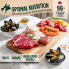 Fresh salmon, duck, and nutrient-rich organ ingredients displayed on a wooden serving board representing the premium high-protein recipe used in Zeal air-dried dog food