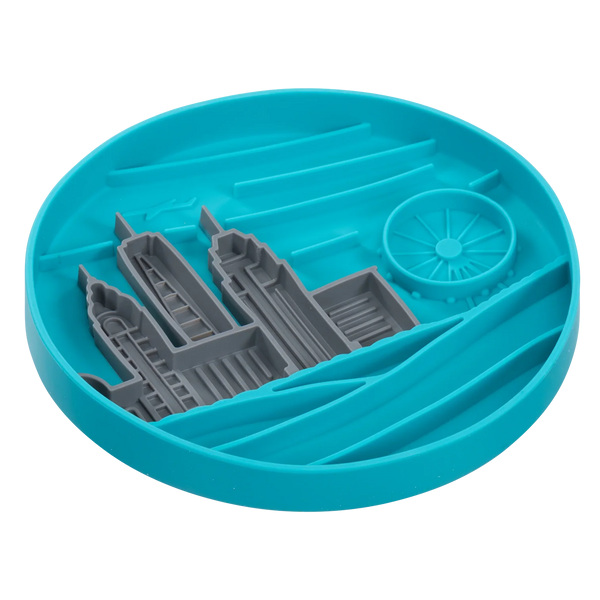 Side angle of the blue silicone lick bowl showing its depth and raised rim that helps contain wet or dry food while promoting slow feeding and reducing spills for cleaner, calmer mealtimes.