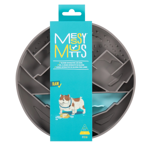 Silicone interactive lick bowl displayed in its retail packaging, highlighting the mess-free raised edges, textured slow-feeding grooves for calming enrichment, strong suction base to prevent slipping, and food-grade BPA- and PVC-free material for safe everyday use and frozen treat enrichment.