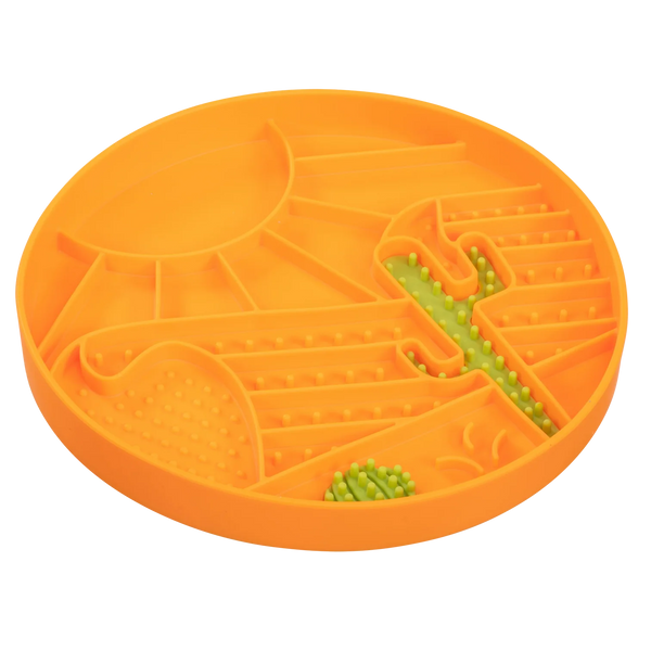 Side-angle view showing the deep, raised rim of the silicone lick bowl that contains wet or dry food, supports slower eating, and prevents spills with a stable, suctioned base.