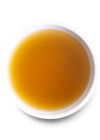 Detailed image of the rich, golden Open Farm Chicken Bone Broth in a bowl, showcasing its texture and quality.