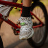 An image of the Tickless Active ultrasonic tick and flea repellent attached to a shoe, demonstrating its flexibility and suitability for various outdoor activities.